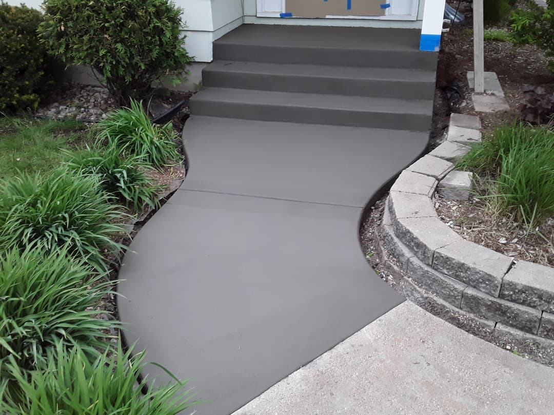 picture of a front concrete walkway for a residential home